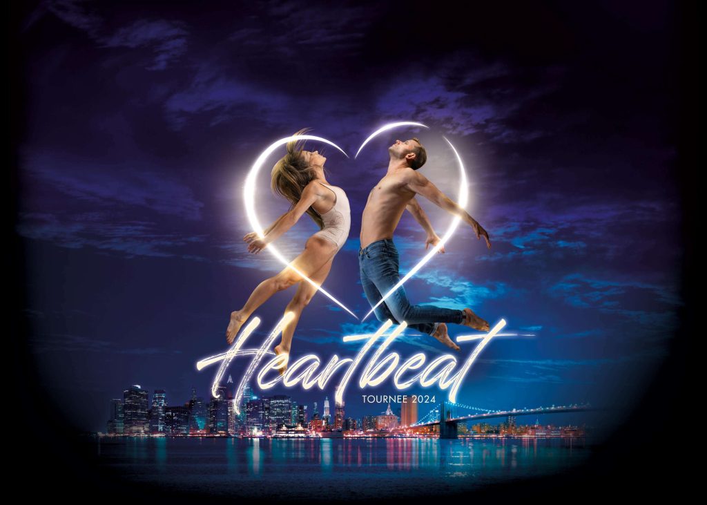 Teaserbild der Heartbeat Tournee 2024 des Feuerwerk der Turnkunst. Ein Mann und eine Frau springen hoch, darauf ein visuell leuchtendes Herz mit dem Schriftzug Heartbeat darunter.
